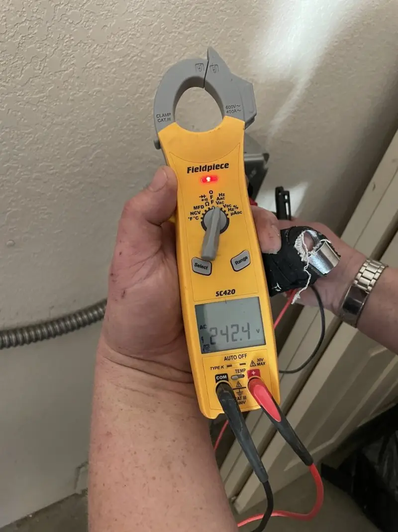 Voltage testing with clamp meter during Ceiling Fan Installation in Fort Lupton